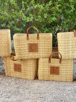 Reed basket with leather letter